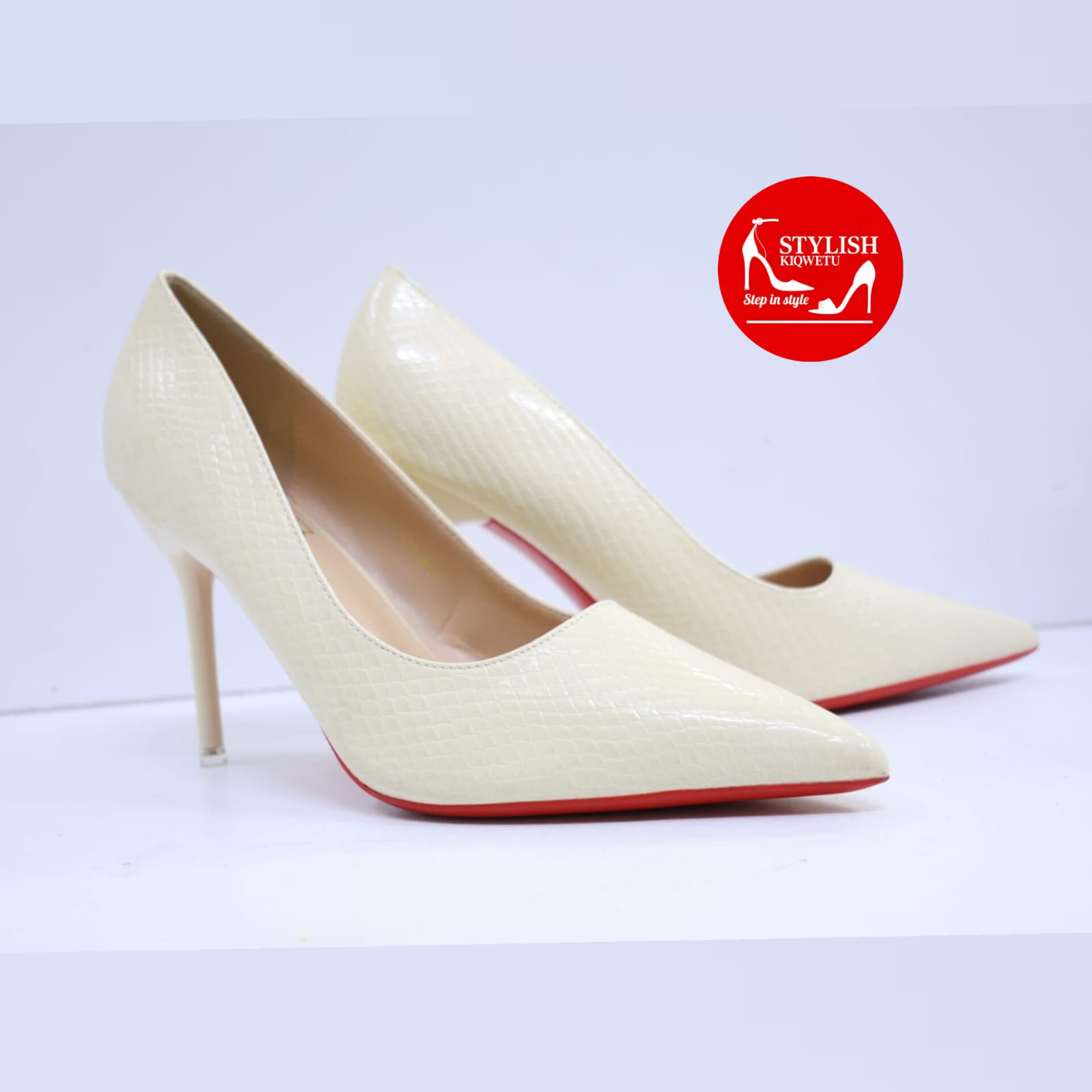 Cream Snake-Embossed Pointed-Toe Red Sole Pumps